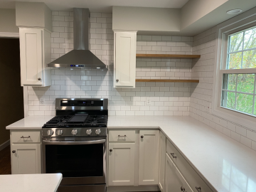 A kitchen with open and closed cabinets built by ATM Contracting LLC.