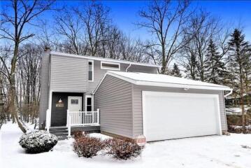 The exterior of a two story house and garage. Showing the construction work of ATM Contracting LLC.