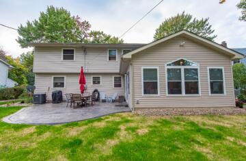 The exterior of a tan house with the sitting area. Construction work done by ATM Contracting LLC.