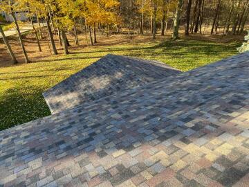 A multicolored roof that was replaced by ATM Contracting LLC.